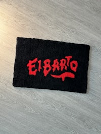 a black towel with red writing on it