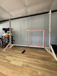 a wooden frame is being built in a room